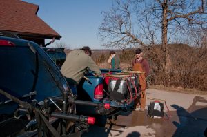 Crew checking backpack pump cans