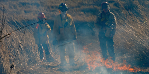 Image of three person prescribed burn crew.