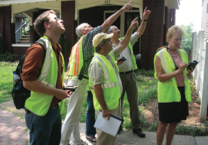 image of people learning to identify tree pests