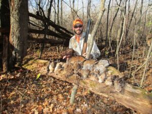 Image of Travis Wilder with a 12 point buck he shot.